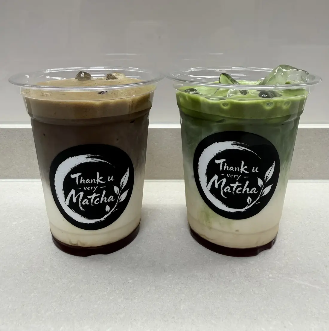 Iced hojicha and iced matcha lattes in Thank u very Matcha cups